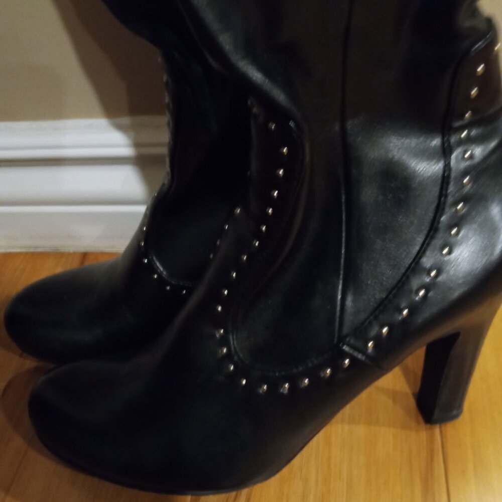 Black high boots.